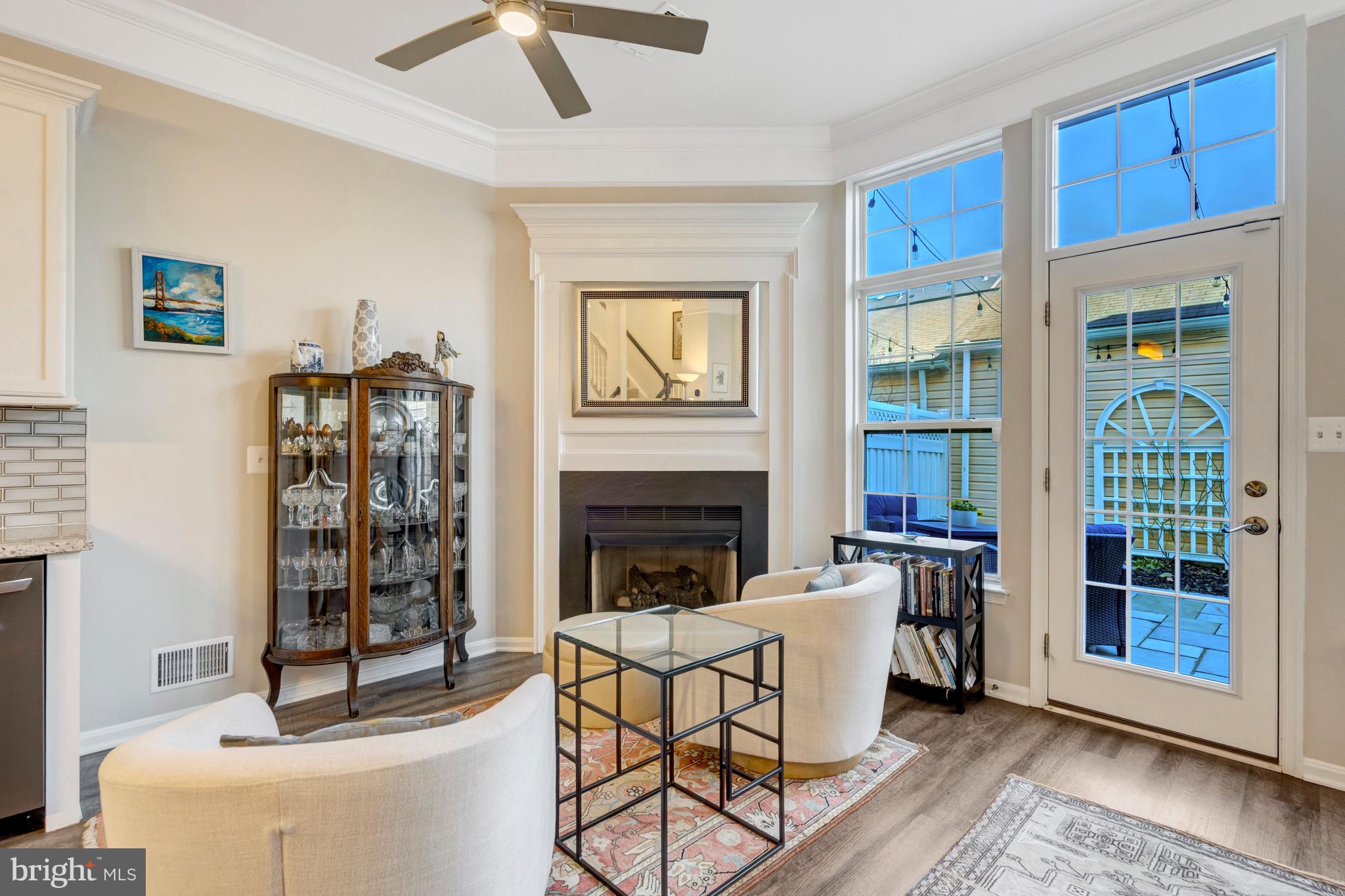43546 Mink Meadows Street Chantilly, VA 20152 - Photo 16 of 48 a living room with furniture a fireplace and a large window