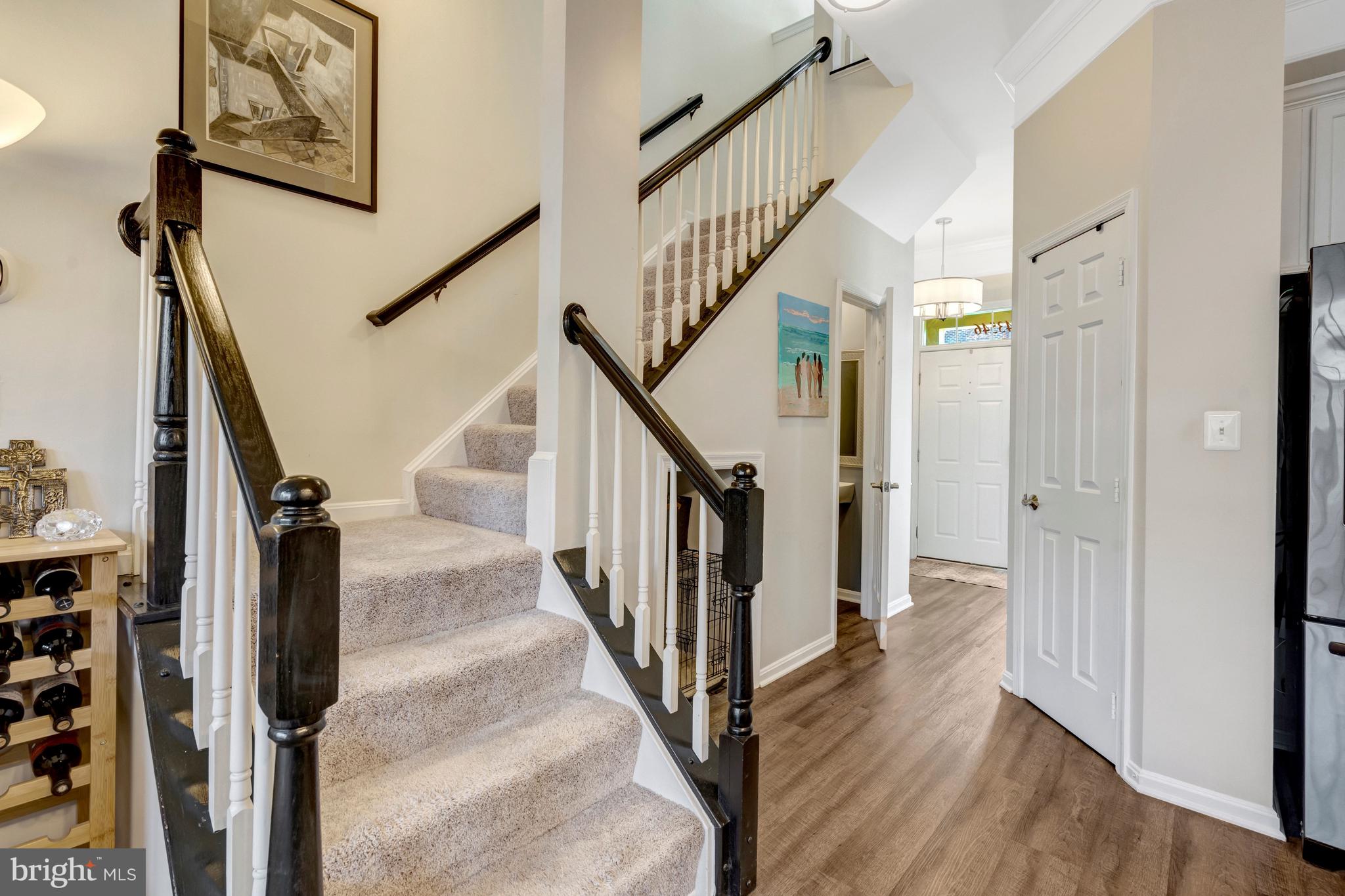 43546 Mink Meadows Street Chantilly, VA 20152 - Photo 17 of 48 a view of a hallway with wooden floor and staircase