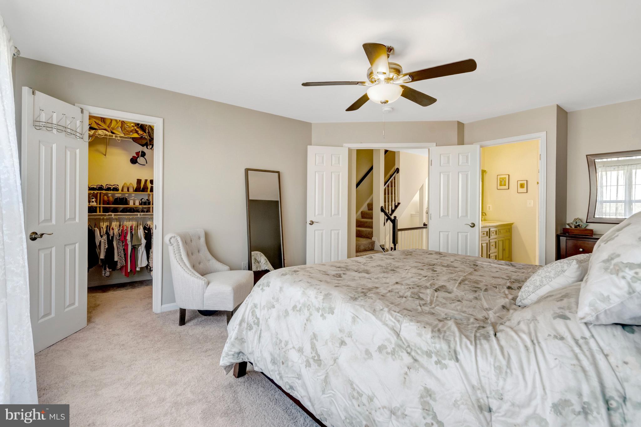 43546 Mink Meadows Street Chantilly, VA 20152 - Photo 24 of 48 a bedroom with a bed and ceiling fan