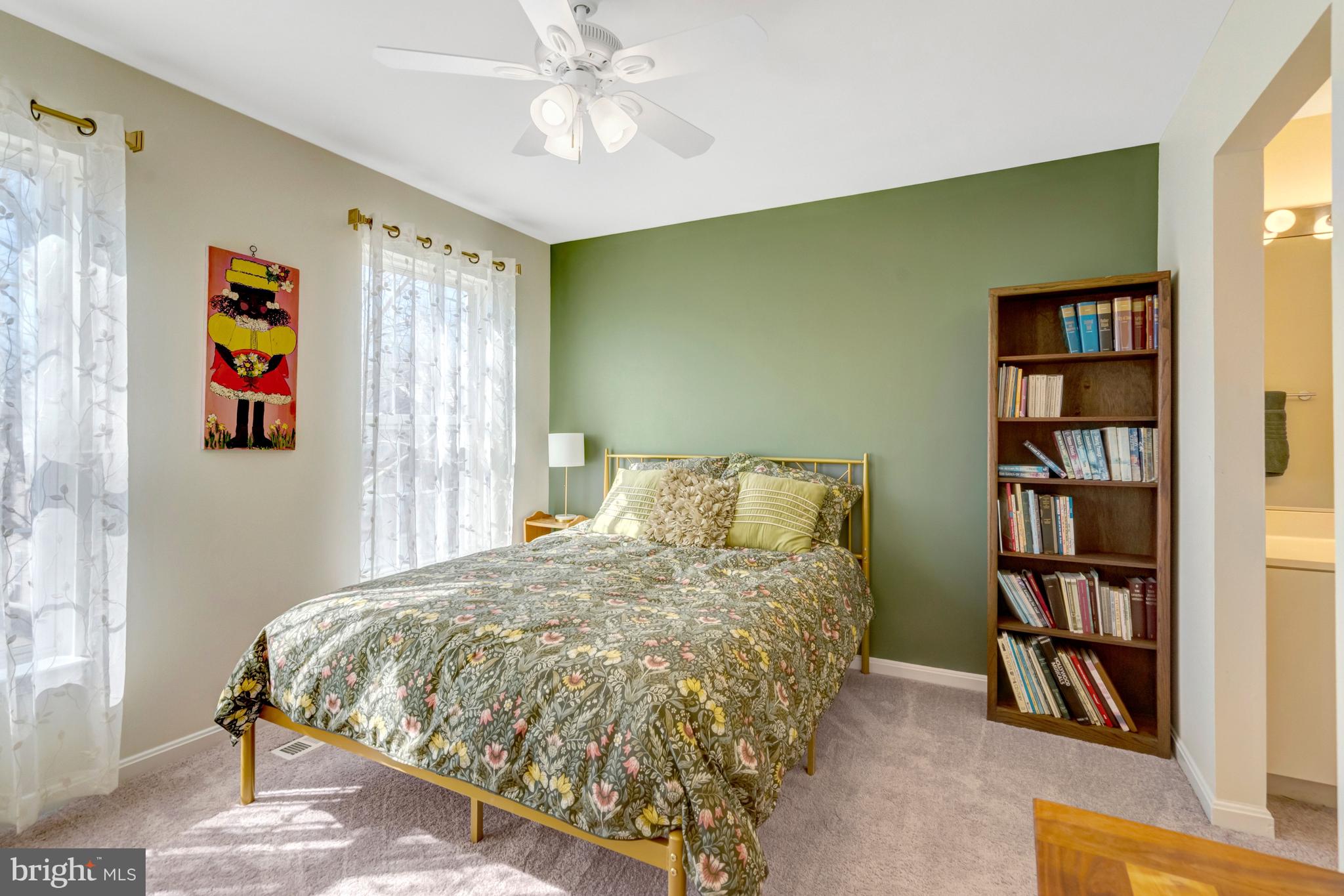 43546 Mink Meadows Street Chantilly, VA 20152 - Photo 30 of 48 a bedroom with a bed and a book shelf