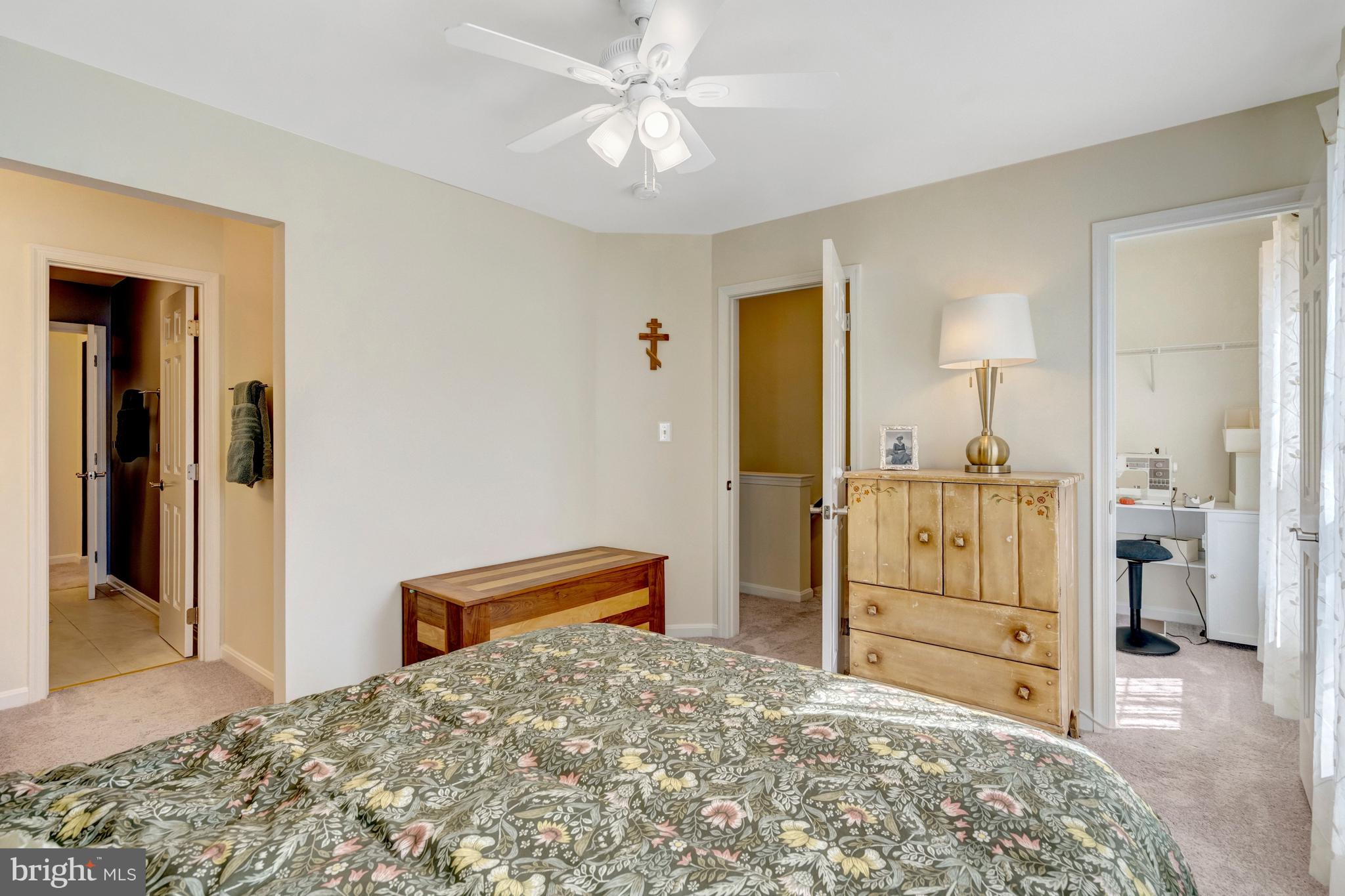 43546 Mink Meadows Street Chantilly, VA 20152 - Photo 31 of 48 a bedroom with a bed and a view of en suite bathroom