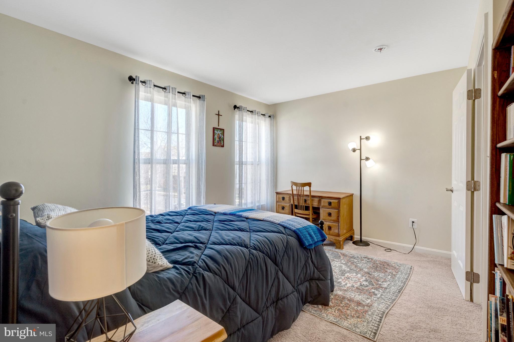 43546 Mink Meadows Street Chantilly, VA 20152 - Photo 35 of 48 a bedroom with a bed and dresser with mirror
