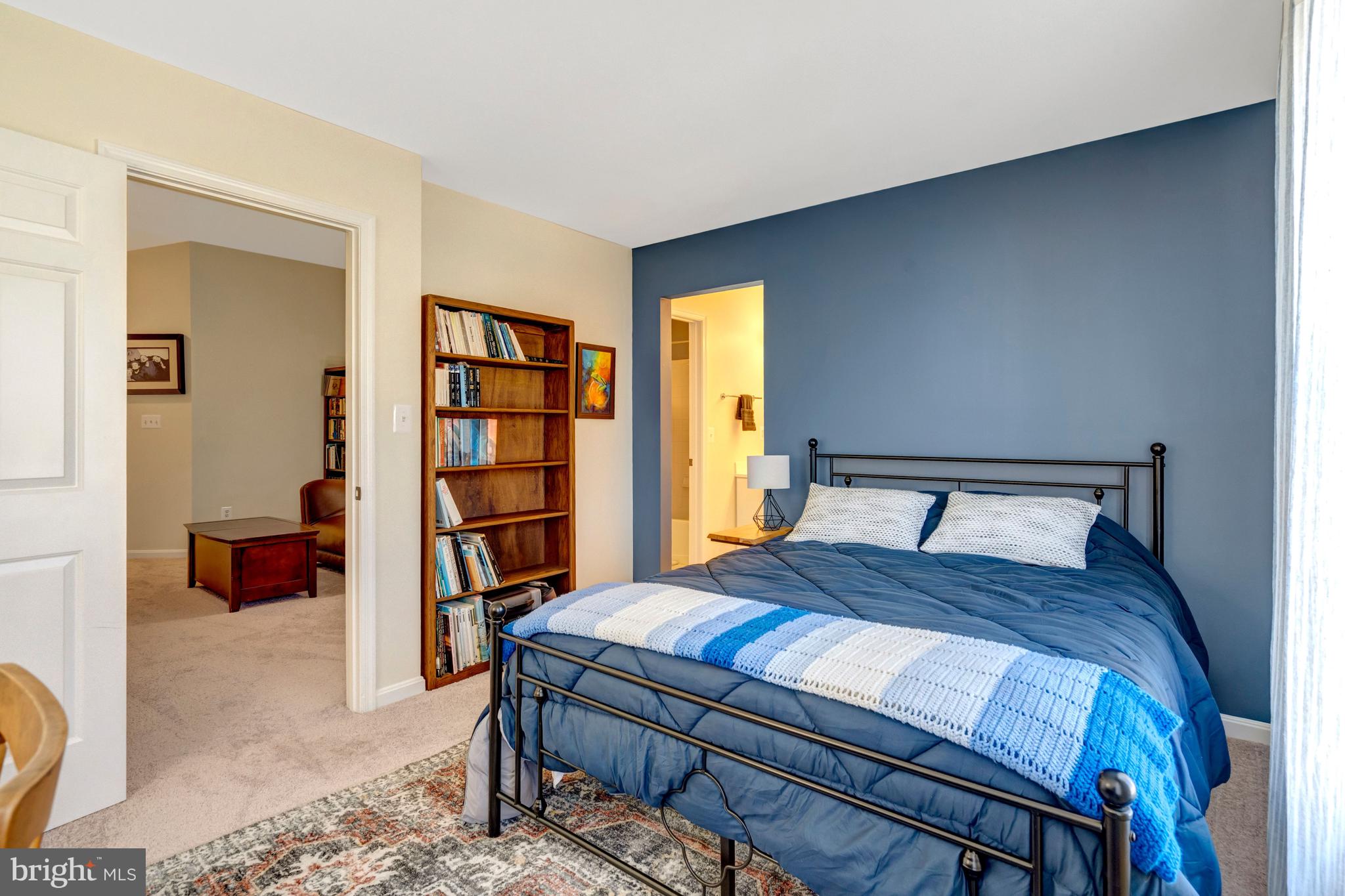 43546 Mink Meadows Street Chantilly, VA 20152 - Photo 38 of 48 a bedroom with a bed a dresser and book shelf