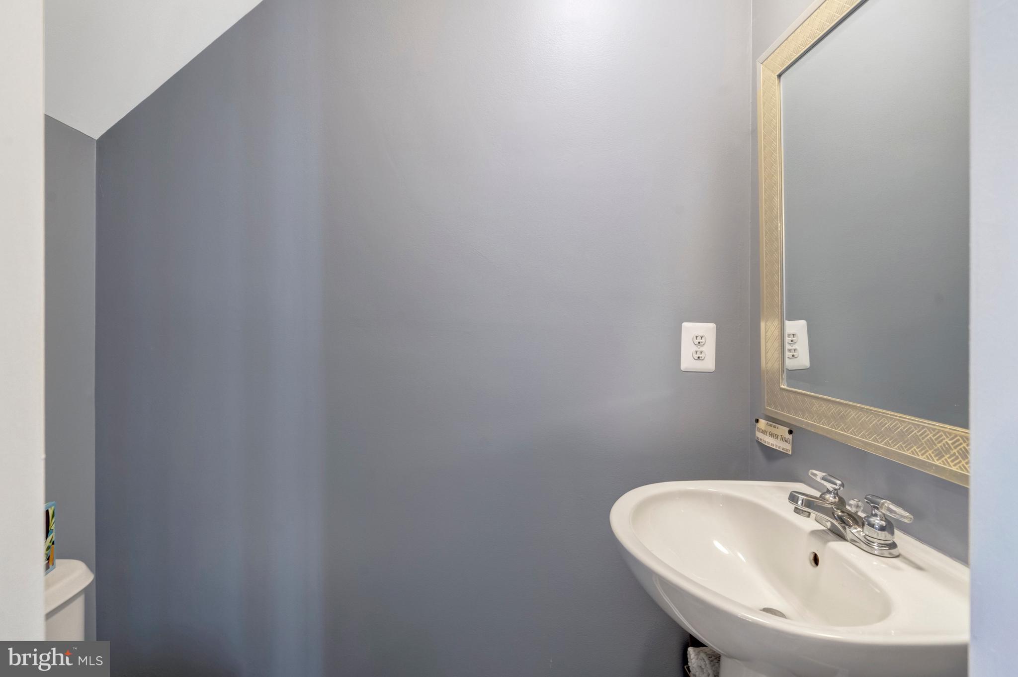 43546 Mink Meadows Street Chantilly, VA 20152 - Photo 8 of 48 a bathroom with a sink and a mirror