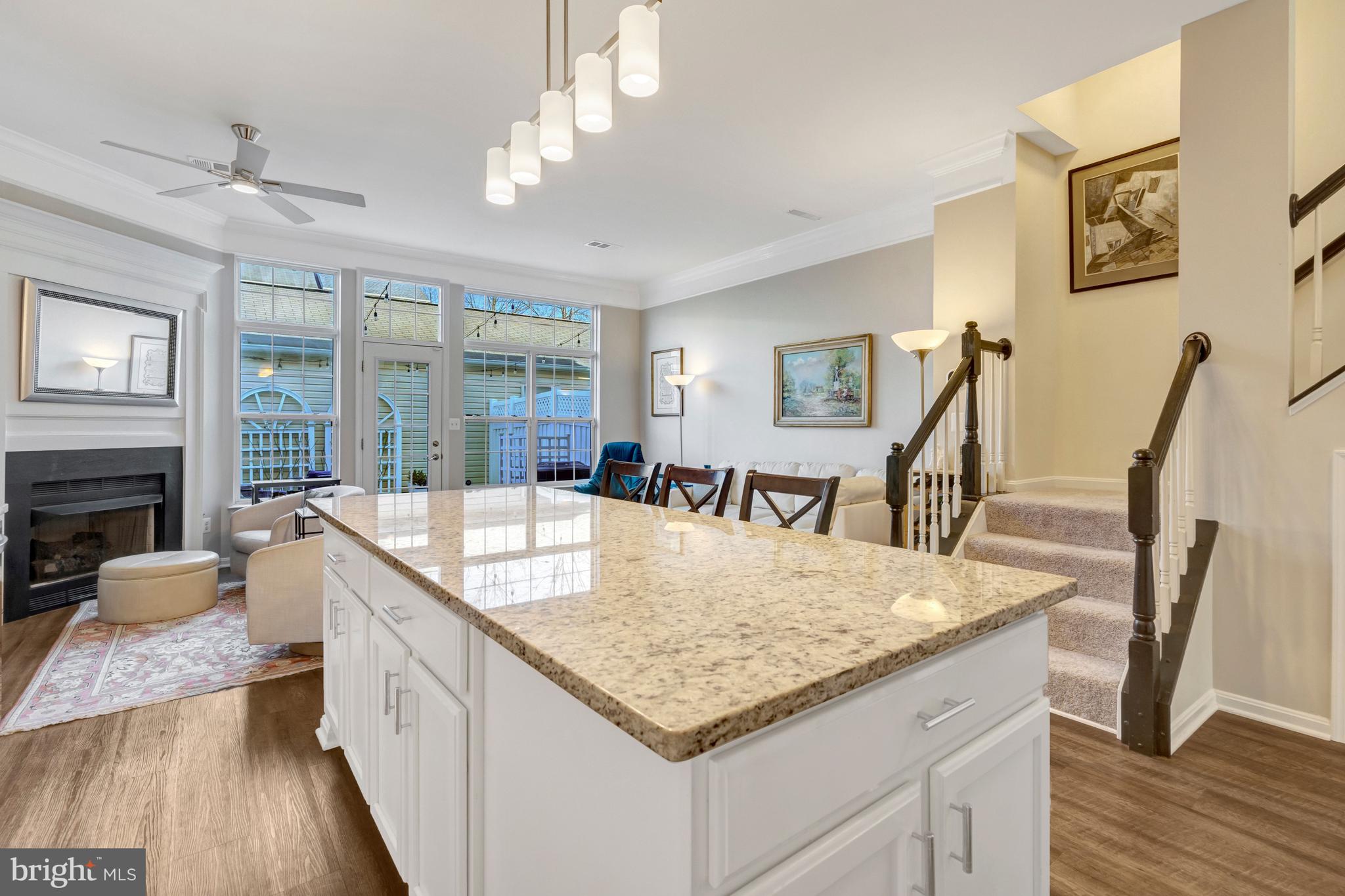 43546 Mink Meadows Street Chantilly, VA 20152 - Photo 10 of 48 a view of kitchen island with granite countertop living room