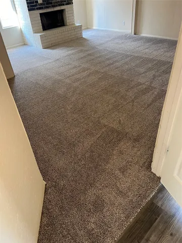 a view of kitchen cabinets and wooden floor