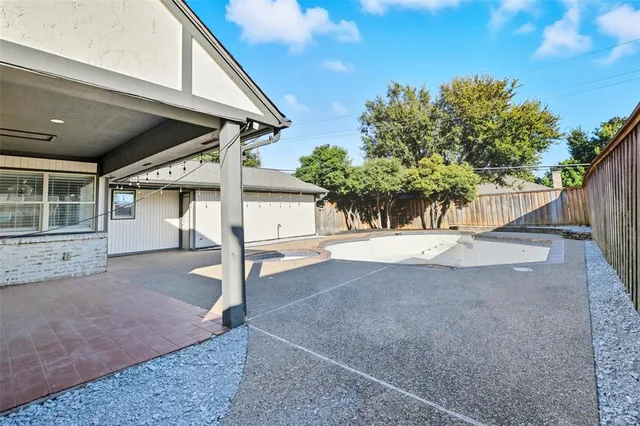 a view of a house with a tree