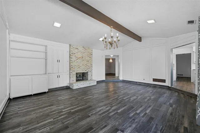 a view of a livingroom with wooden floor