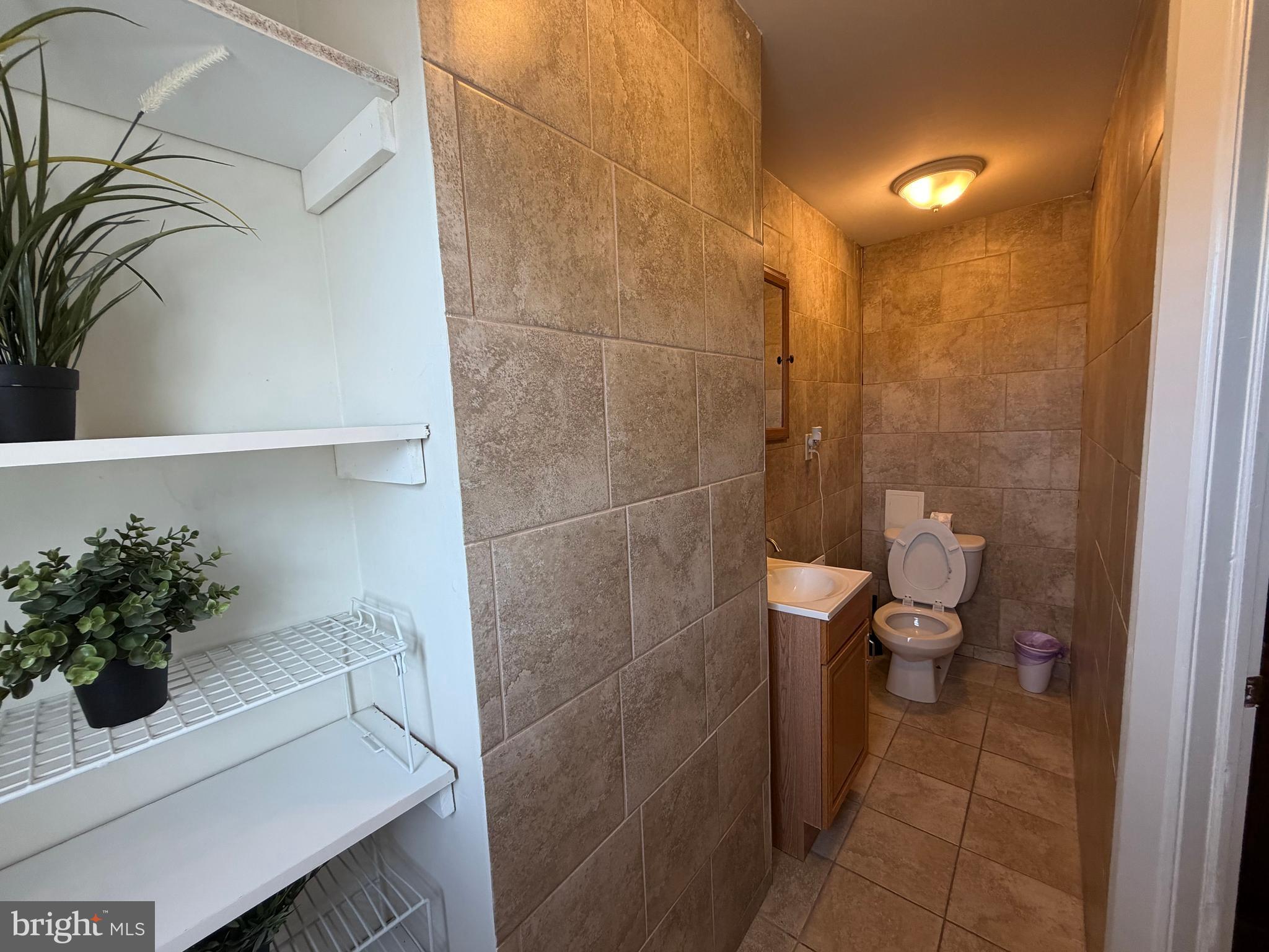7103 Rising Sun Avenue, Unit C Philadelphia, PA 19111 - Photo 16 of 19 a bathroom with a sink and toilet