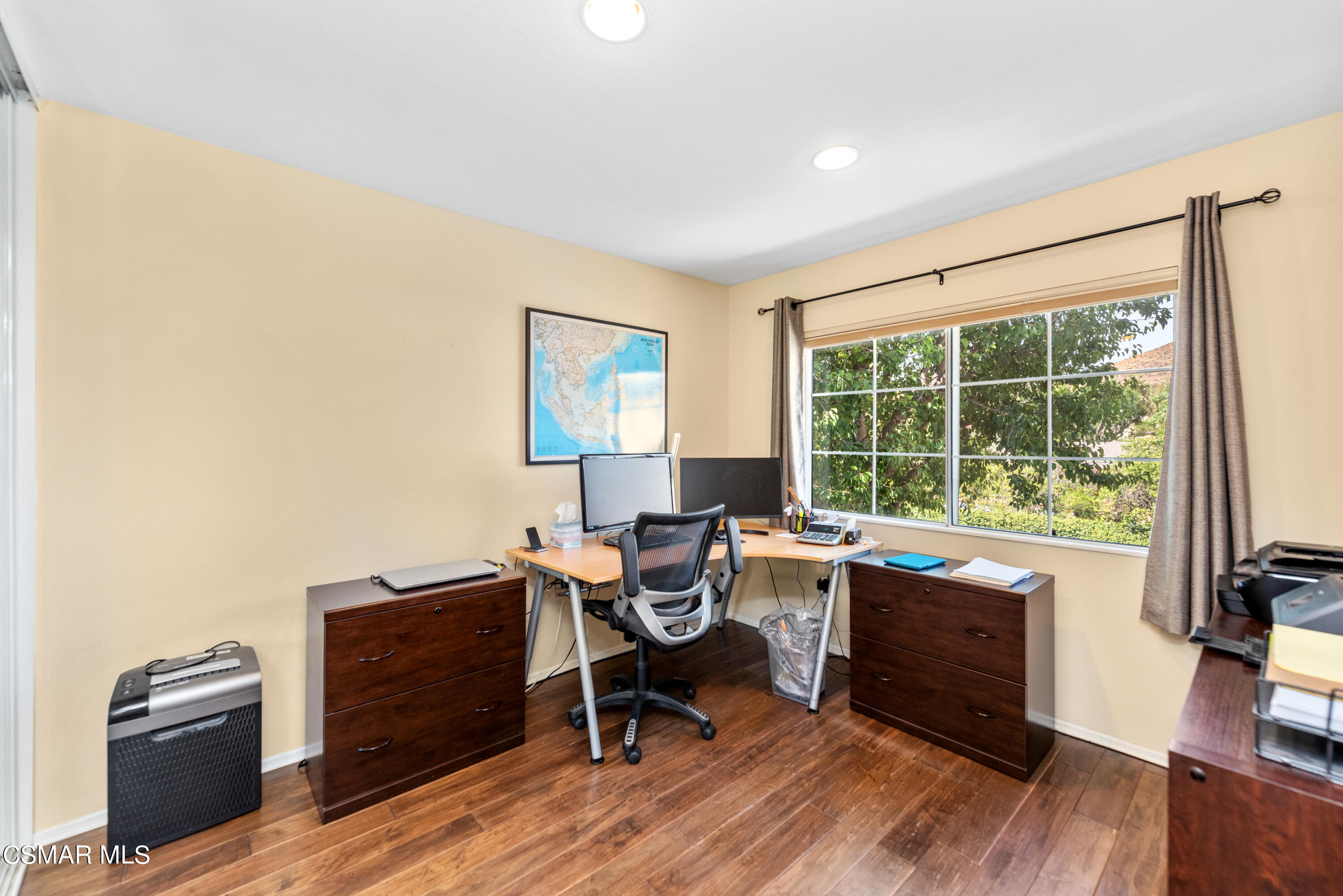 5248 Portia Street Simi Valley, CA 93063 - Photo 27 of 45 a work room with wooden floor and furniture