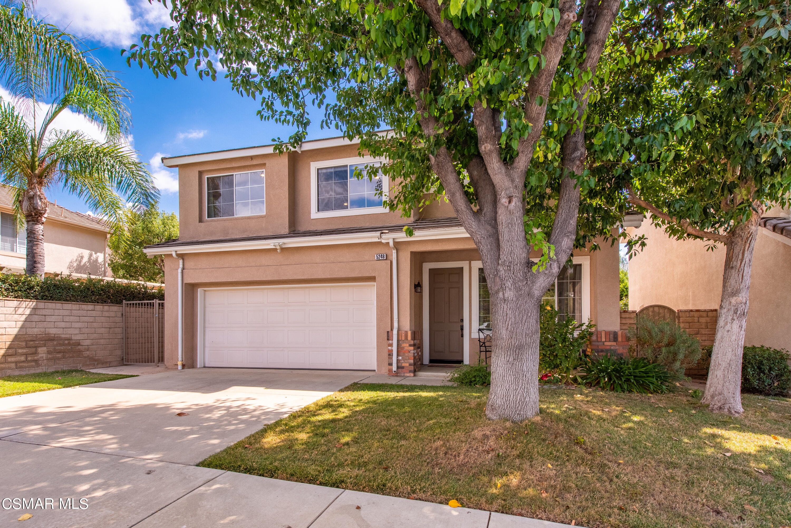 5248 Portia Street Simi Valley, CA 93063 - Photo 3 of 45 a front view of a house with garden