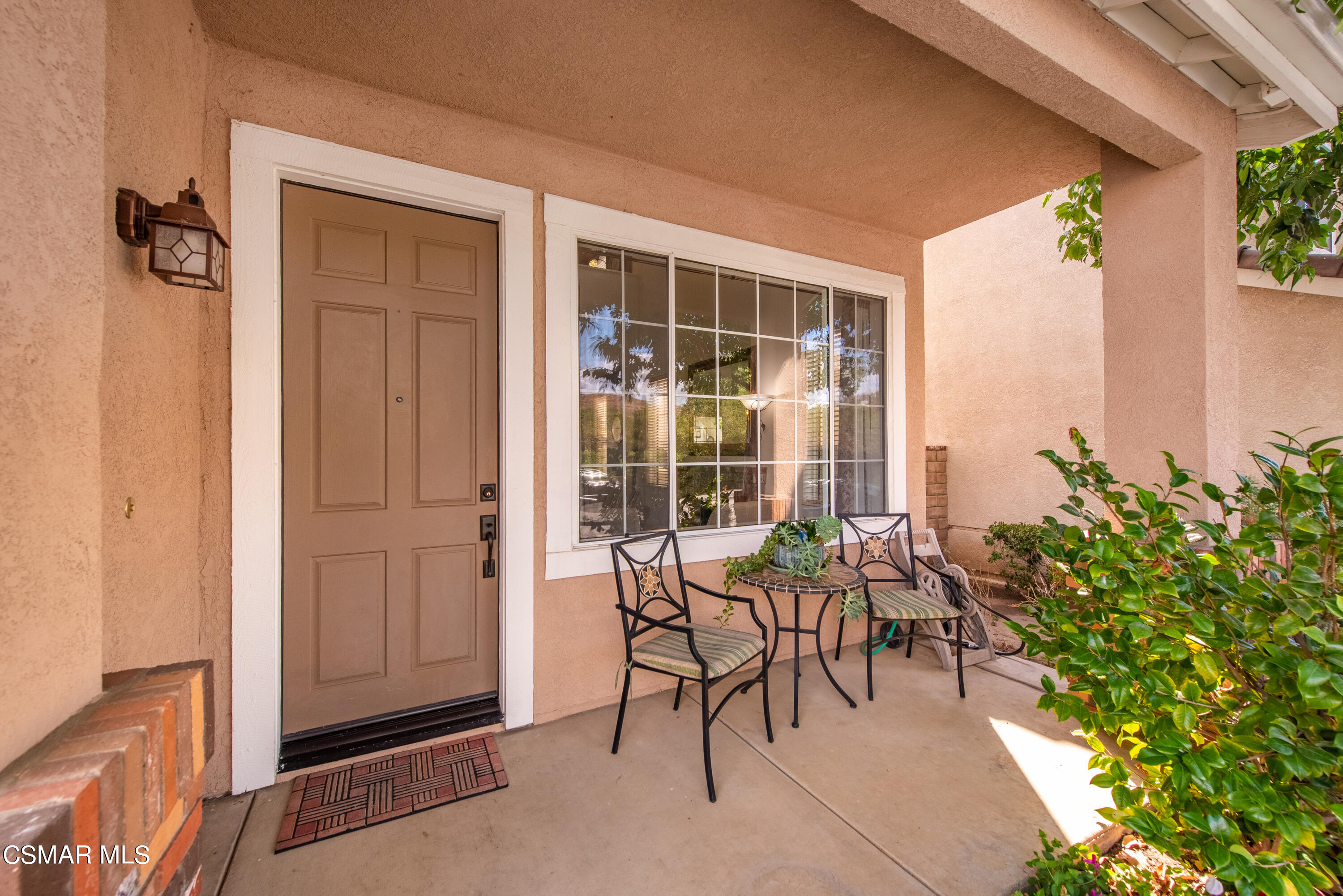 5248 Portia Street Simi Valley, CA 93063 - Photo 4 of 45 a view of a porch with chairs and potted plants