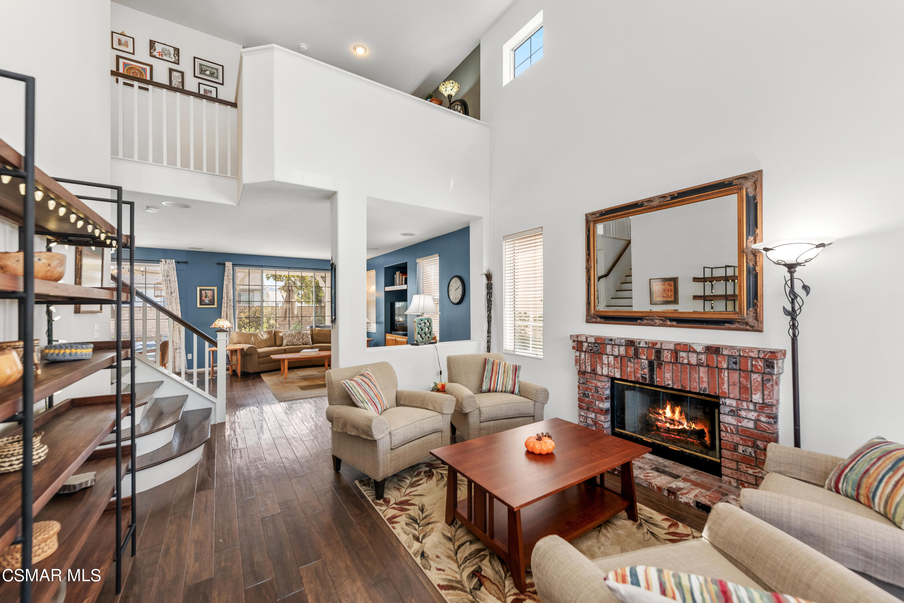 5248 Portia Street Simi Valley, CA 93063 - Photo 5 of 45 a living room with furniture a fireplace and a large window