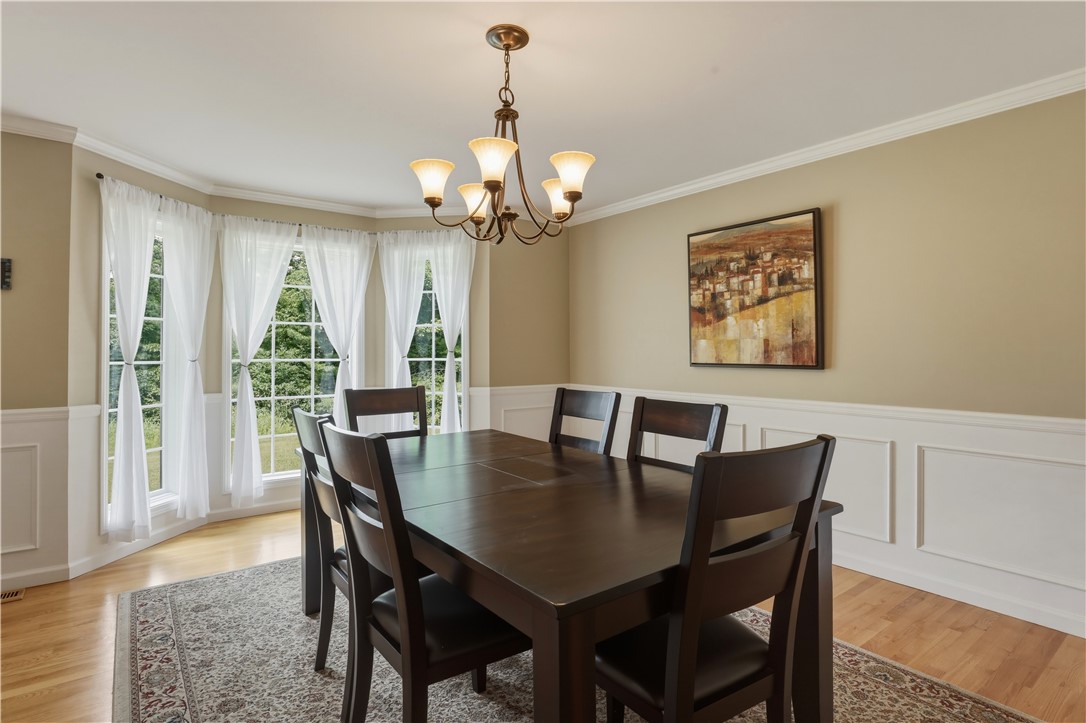 3200 Goff Road Corning, NY 14830 - Photo 20 of 50 This room features a walkout bay window and hardwo