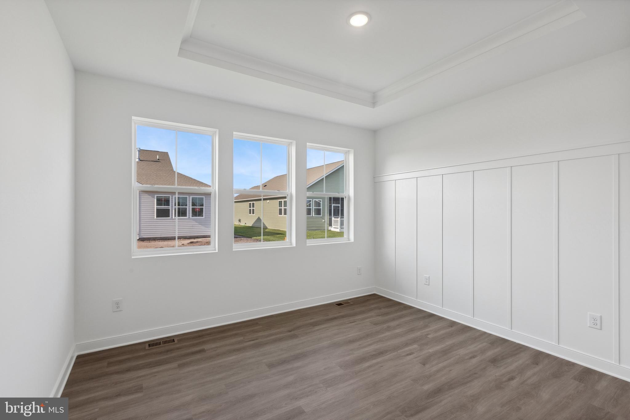 36332 Gate Drive Georgetown, DE 19947 - Photo 13 of 30 a view of an empty room with wooden floor and a window