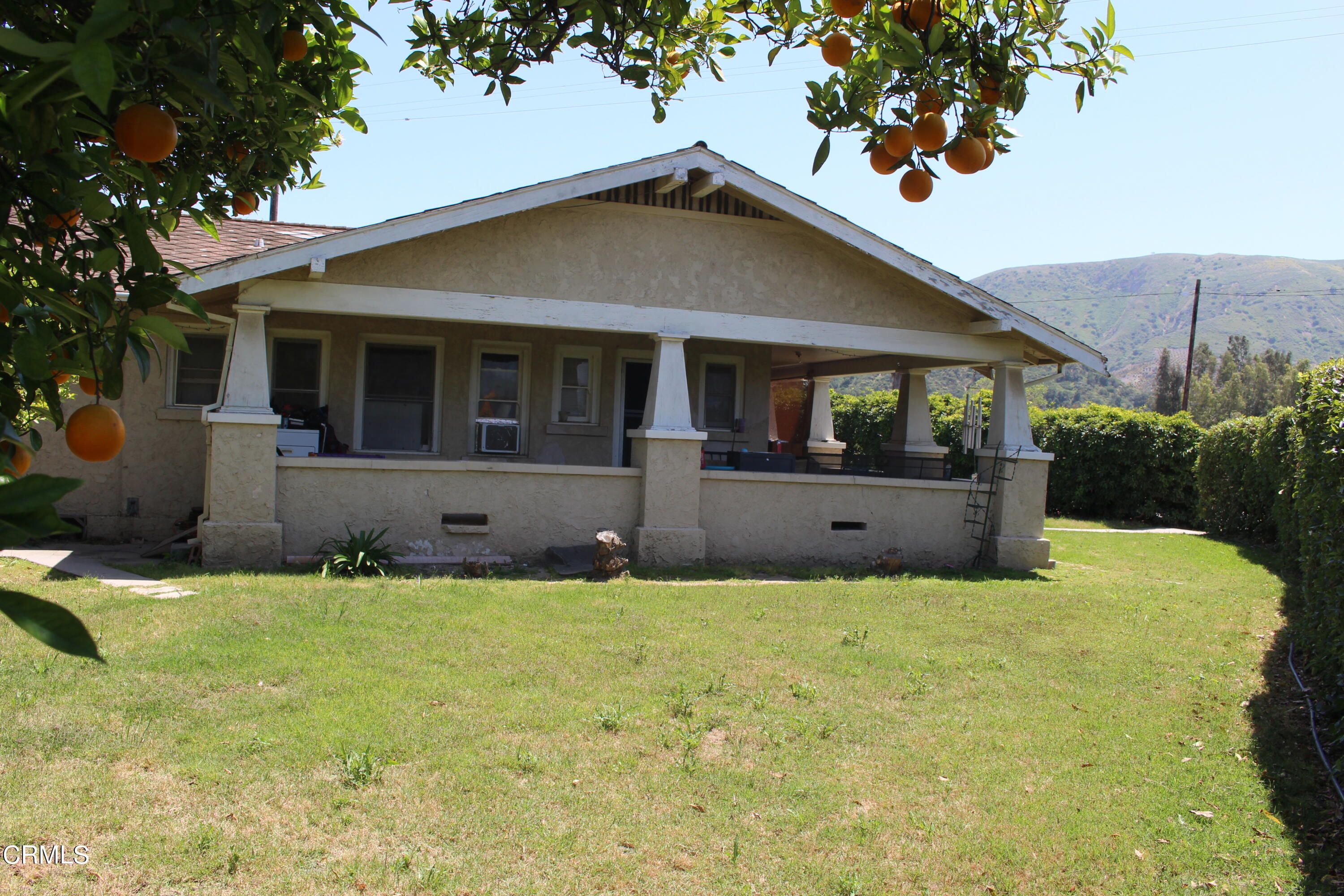 1396 South Sespe Street Fillmore, CA 93015 - Photo 1 of 20 a front view of a house with a yard and garage