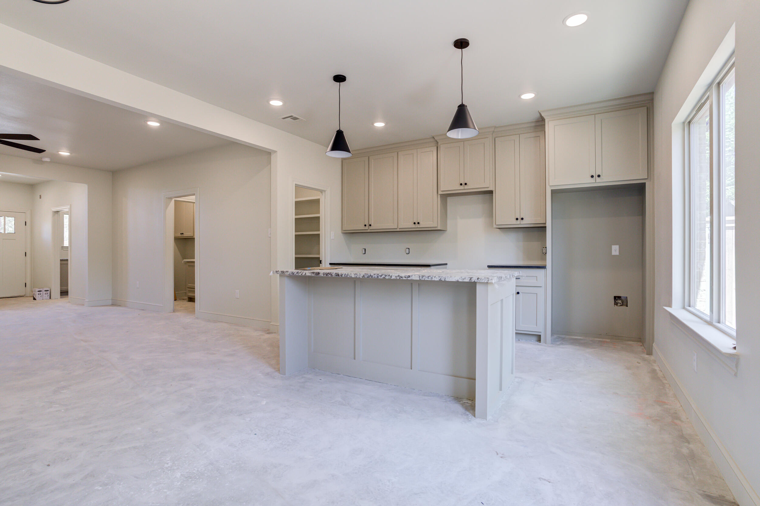 3419 24th Street Lubbock, TX 79410 - Photo 17 of 45 a view of kitchen with kitchen island and stainless steel appliances