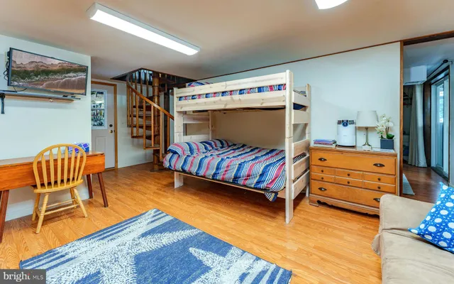 an aerial view of a house with a yard basket ball court and outdoor seating