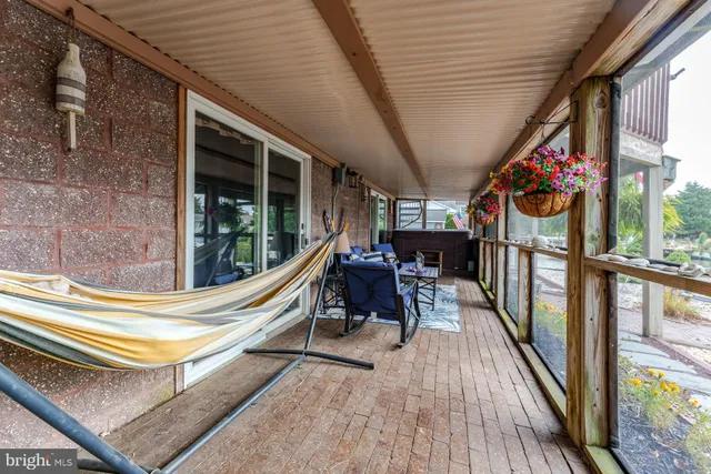an aerial view of residential building with outdoor space and lake view