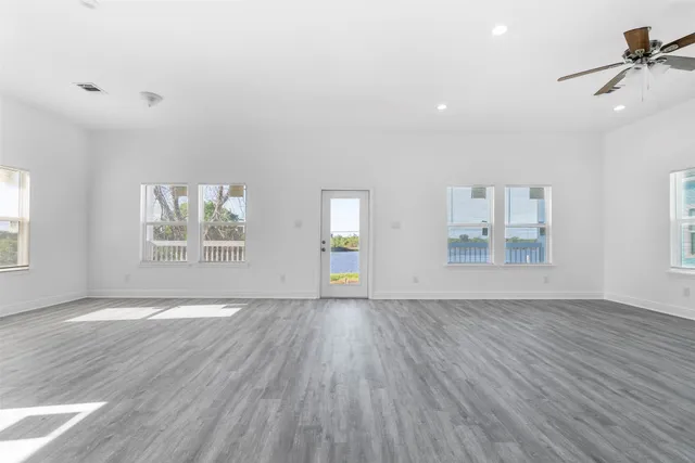 a view of a hallway with wooden shelves
