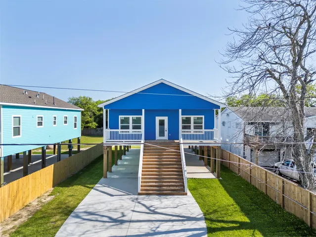 an aerial view of residential houses with outdoor space and swimming pool