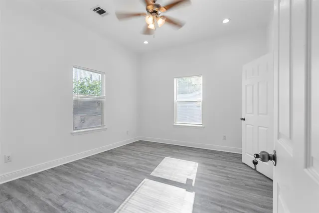 a white bath tub sitting next to a white toilet