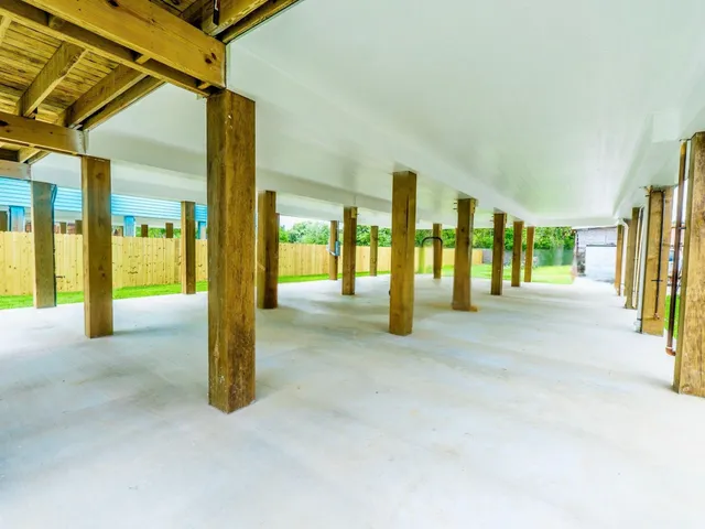 a view of yard with swimming pool and sitting area