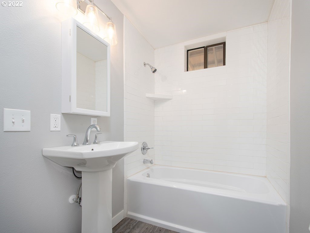 73417 Doan Road Rainier, OR 97048 - Photo 8 of 32 a bathroom with a sink a mirror and a bathtub