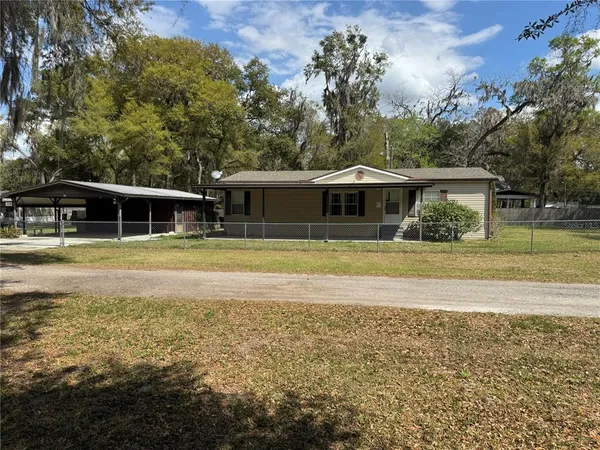 a view of house with swimming pool and outdoor space