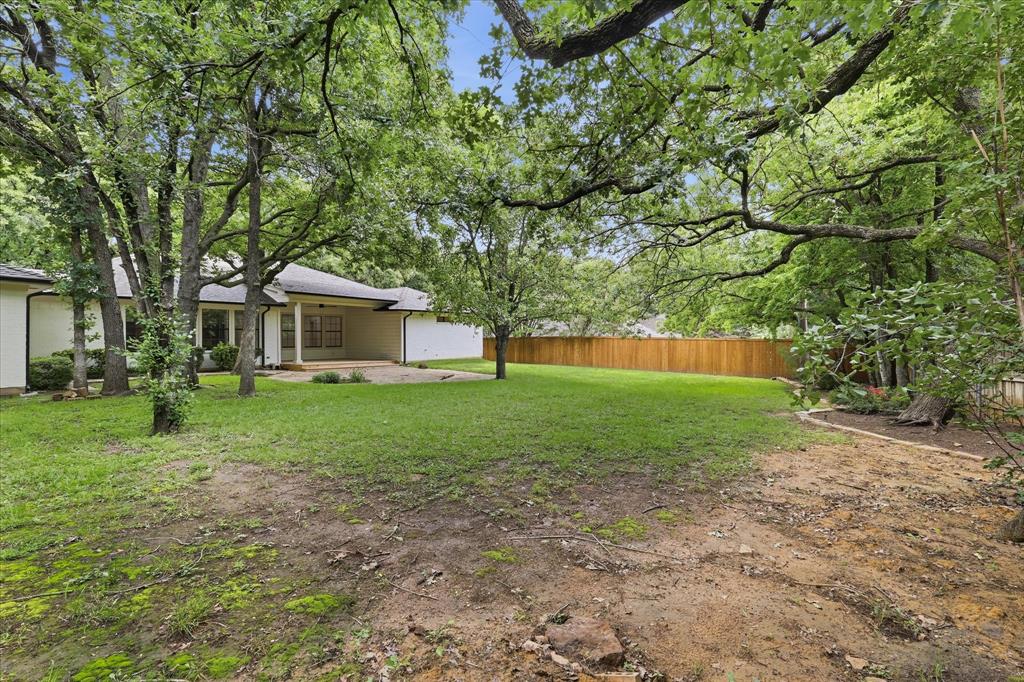 19 Timbergreen Circle Denton, TX 76205 - Photo 37 of 40 a view of a house with backyard and tree