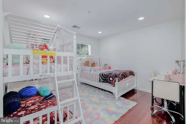 a bathroom with a granite countertop sink a vanity and a shower