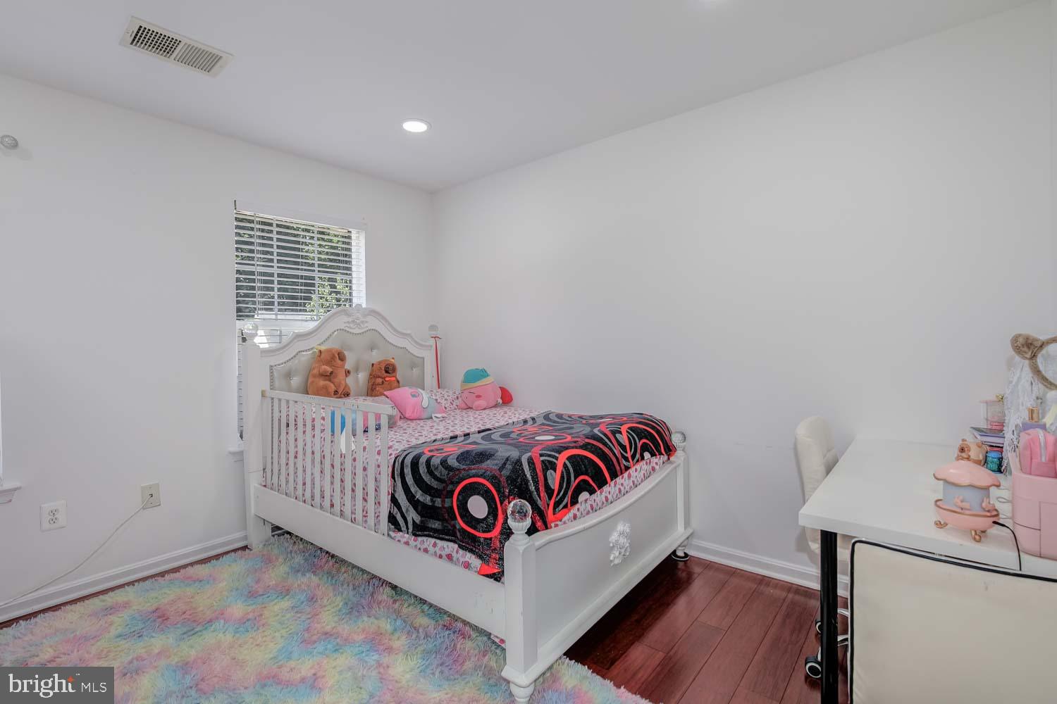 6810 Ashleys Crossing Court Temple Hills, MD 20748 - Photo 29 of 45 a bedroom with a bed and a window