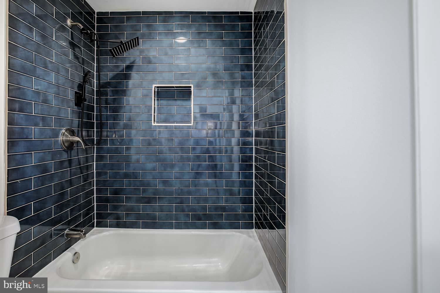 6810 Ashleys Crossing Court Temple Hills, MD 20748 - Photo 31 of 45 a bathroom with a shower and a bath tub