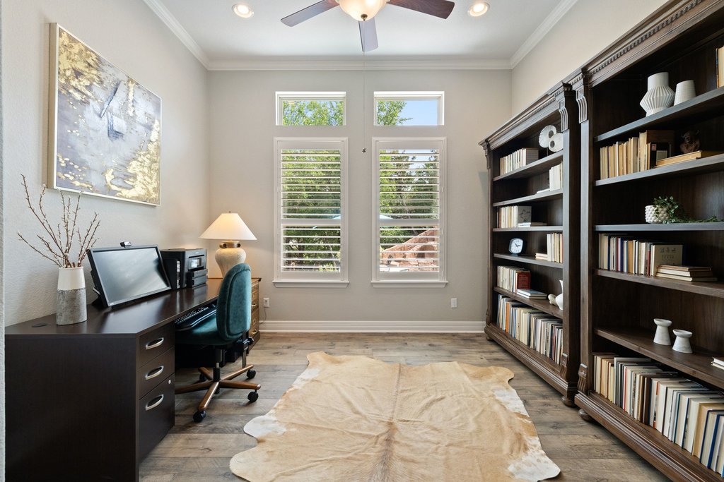 108 Berry Cove Georgetown, TX 78628 - Photo 15 of 39 a living room with bookshelf and a window