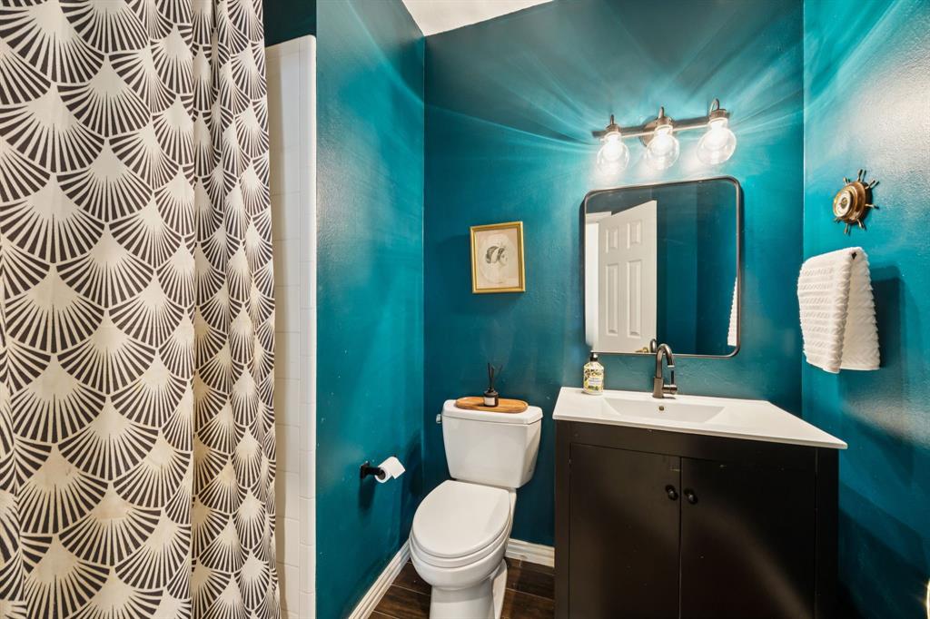 902 Kilgore Court Allen, TX 75013 - Photo 12 of 32 a bathroom with a sink and mirror with toilet