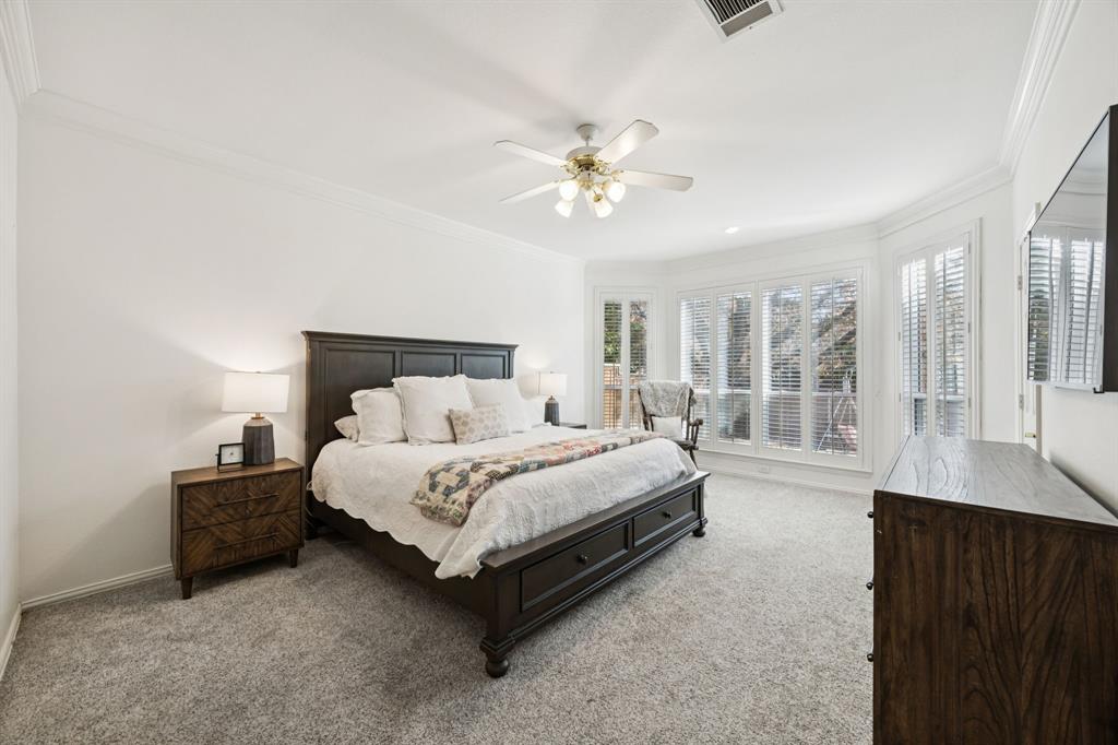 902 Kilgore Court Allen, TX 75013 - Photo 13 of 32 a spacious bedroom with a bed and a large window