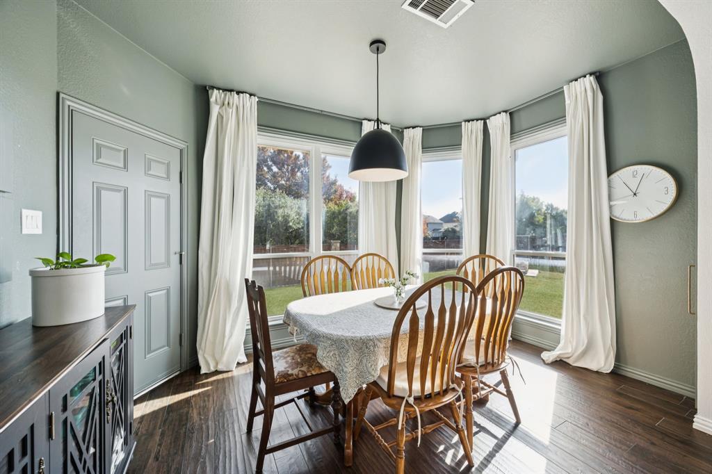 902 Kilgore Court Allen, TX 75013 - Photo 19 of 32 a view of a dining room with furniture window and wooden floor