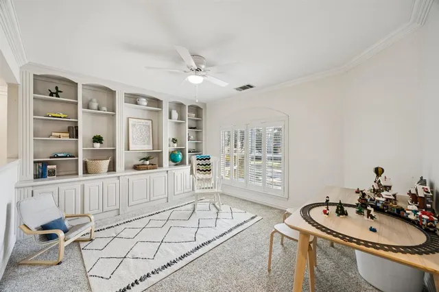 a spacious bathroom with a double vanity sink a mirror a bathtub and next to a window