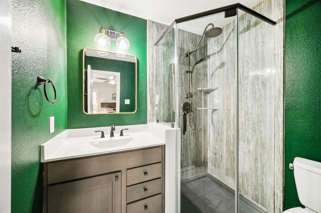 902 Kilgore Court Allen, TX 75013 - Photo 22 of 32 a bathroom with a sink vanity mirror and toilet