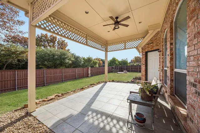a view of a backyard with wooden floor and a garden