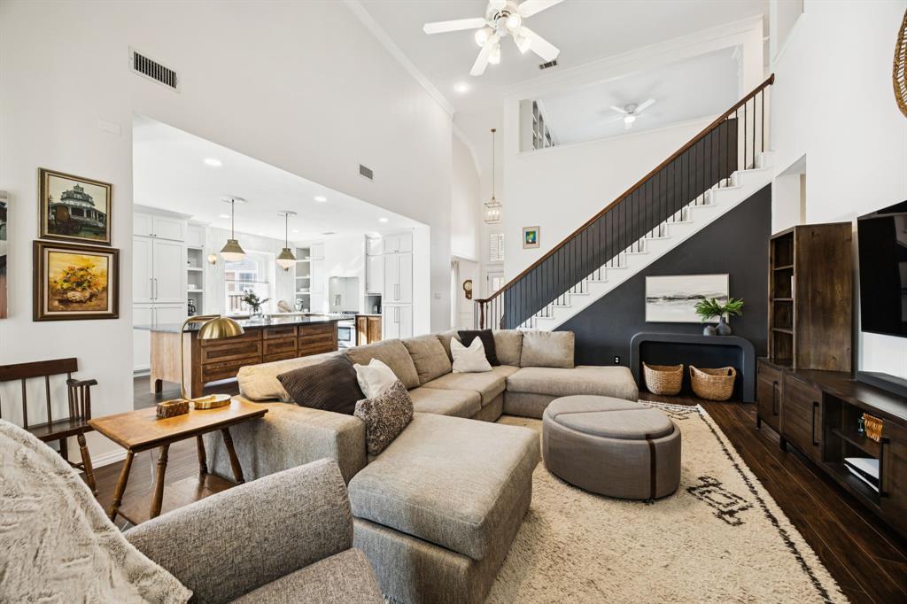 902 Kilgore Court Allen, TX 75013 - Photo 10 of 32 a living room with furniture a flat screen tv and kitchen view