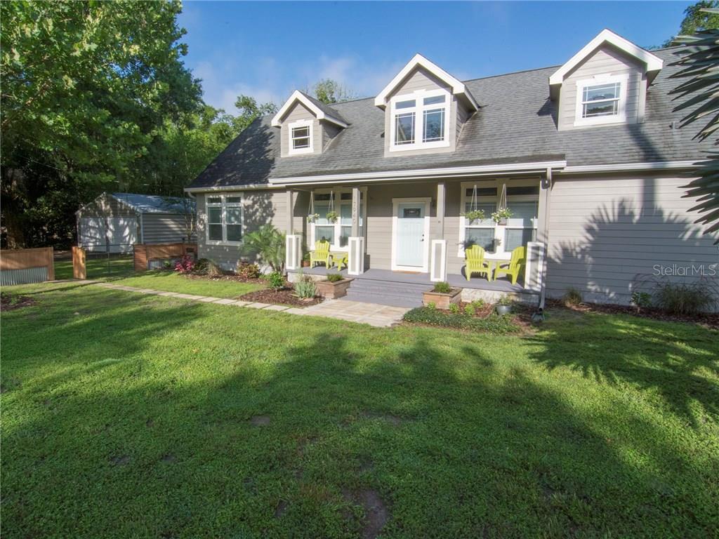 17940 Simmons Road Lutz, FL 33548 - Photo 1 of 1 a view of a house with a yard and sitting area