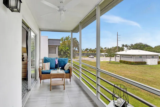 a reading room with furniture and wooden floor