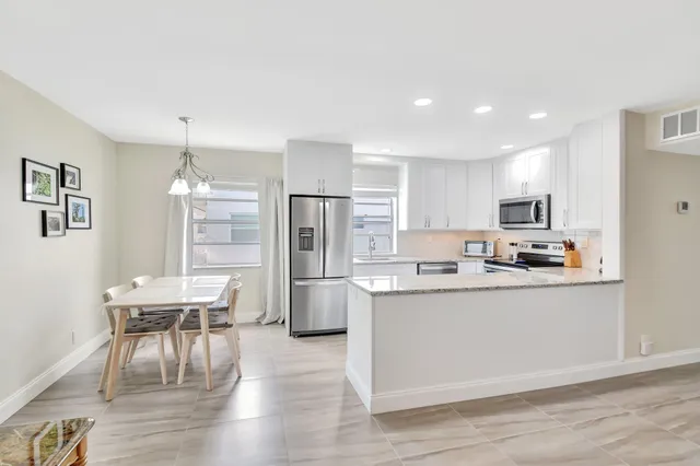 a large kitchen with a stove top oven