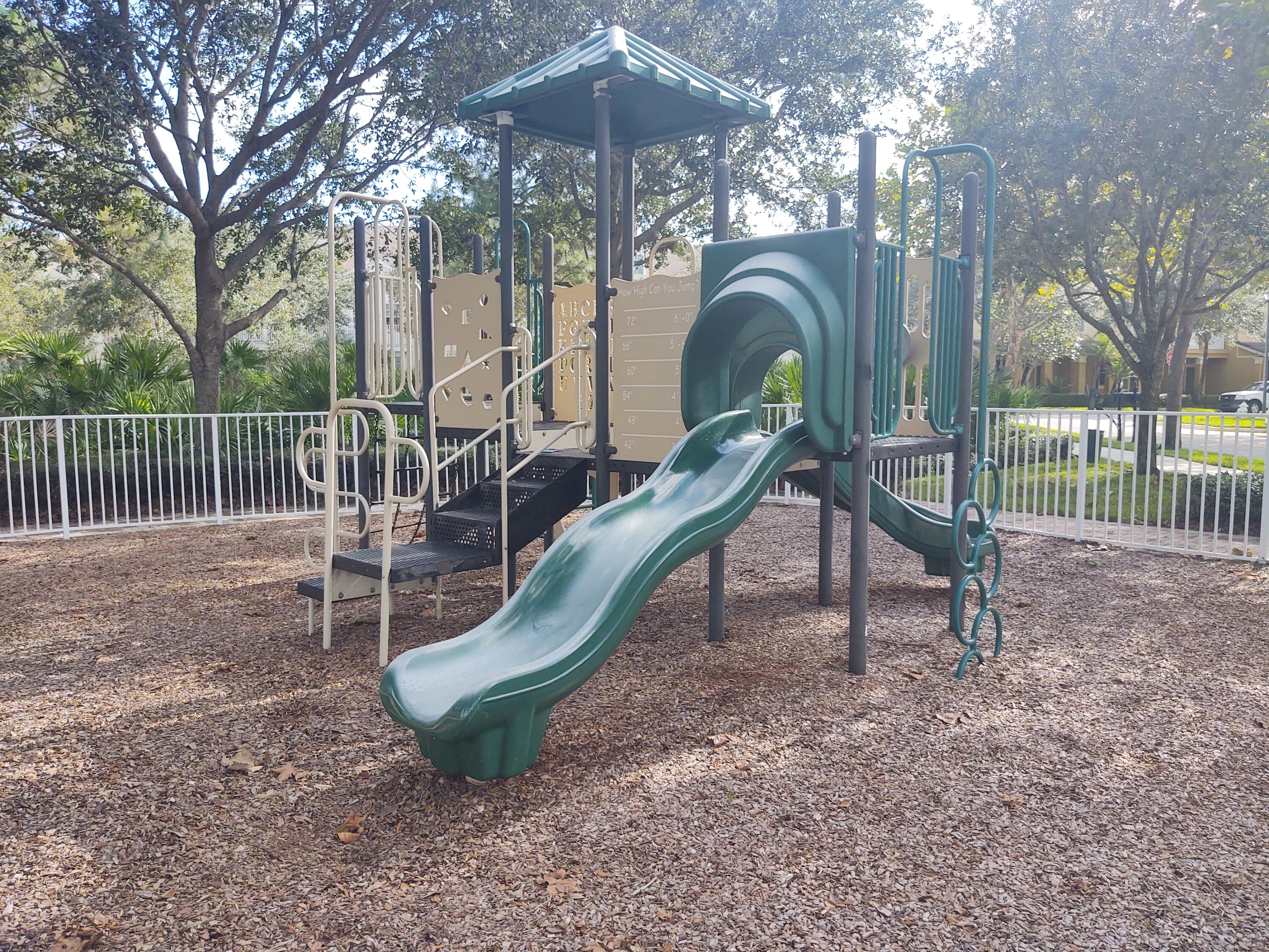 265 Indian Creek Parkway, Unit 102 Jupiter, FL 33458 - Photo 19 of 21 a view of a park with iron fence