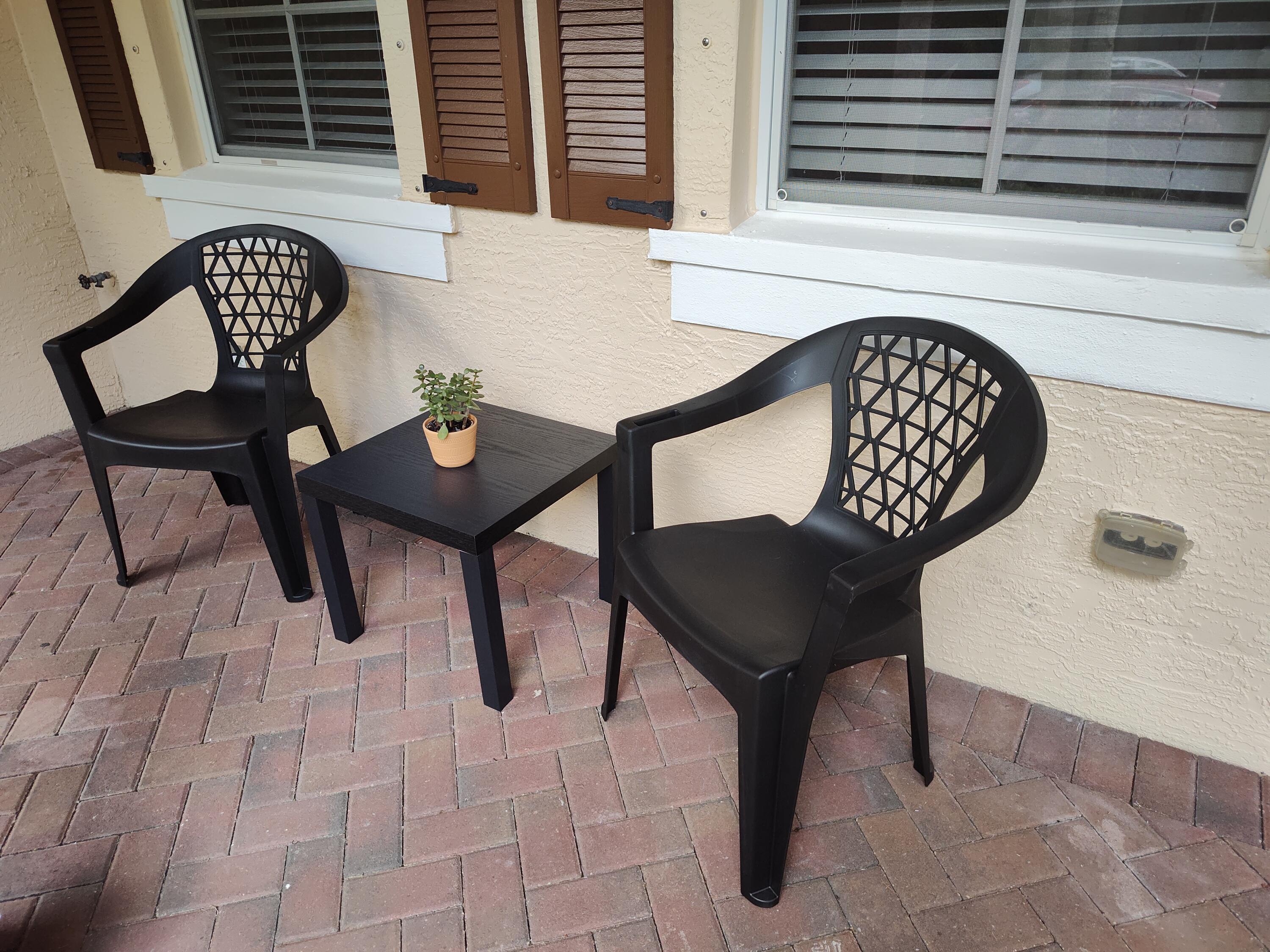 265 Indian Creek Parkway, Unit 102 Jupiter, FL 33458 - Photo 2 of 21 a view of a chairs and table in a balcony