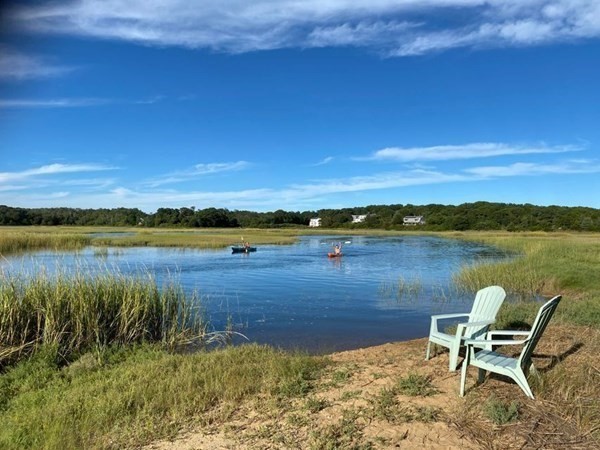 16 Boat Meadow Way Eastham, MA 02642 - Photo 1 of 42 a view of a lake with a outdoor space