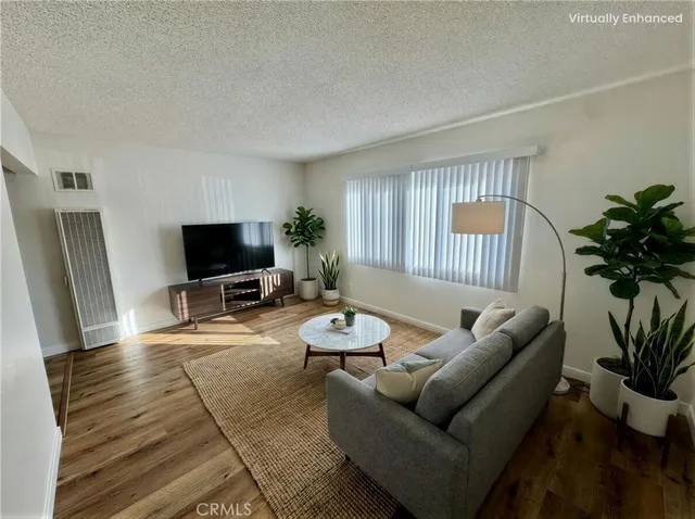 a kitchen with a stove a refrigerator and a stove top oven