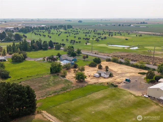 an aerial view of a houses with a lake view