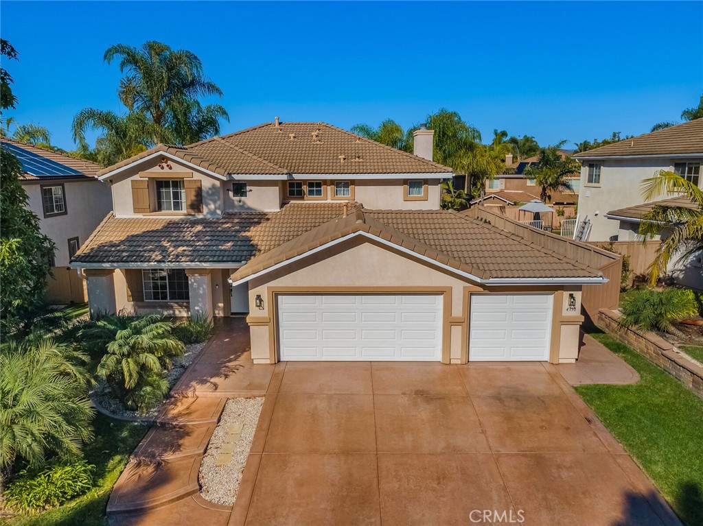4330 Forest Ranch Way Oceanside, CA 92057 - Photo 40 of 51 From above, this view captures the home’s impressive curb appeal from the front, highlighting the triple-wide driveway, manicured landscaping, and strong street presence within the gated River Ranch community.